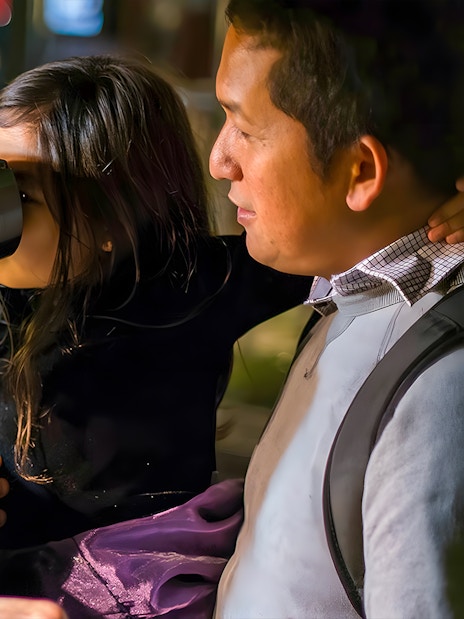 Child exploring exhibit with adult at the Exploratorium, San Francisco.