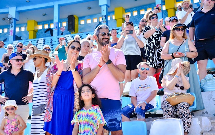 Spectators enjoying a dolphin show at Hurghada stadium.