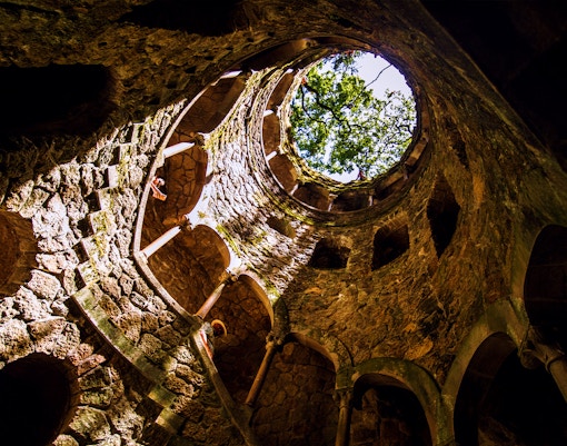 Initiation well of Quinta da Regaleira with spiral staircase in Sintra, Portugal.