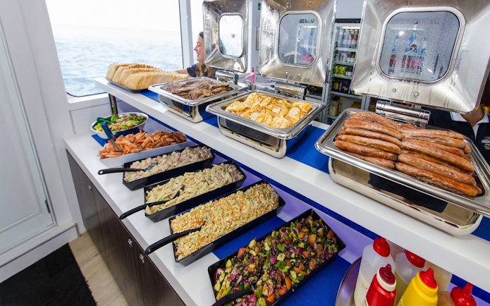 Barbecue buffet lunch on a cruise ship with ocean view during Great Barrier Reef cruise.