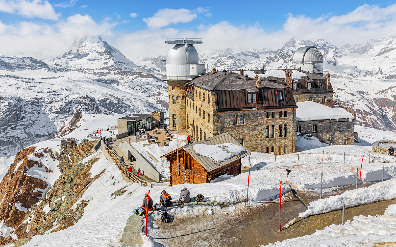 Kulmhotel Gornergrat with observatory and snowy Matterhorn backdrop, Zermatt.