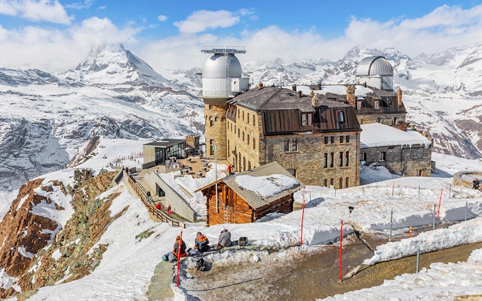 Kulmhotel Gornergrat with observatory and snowy Matterhorn backdrop, Zermatt.