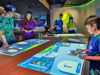 People looking at technology in Petrosains, The Discovery Centre