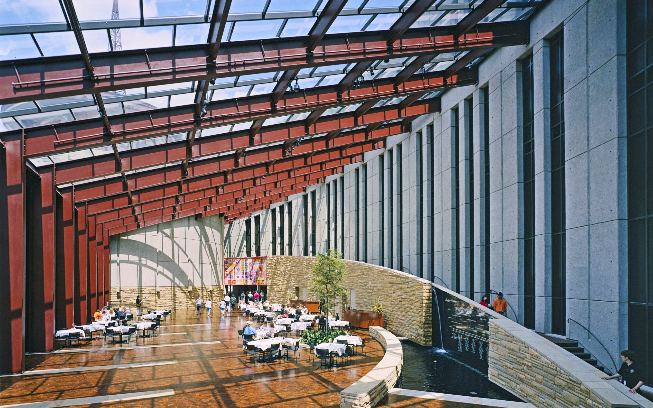 Interior of Country Music Hall of Fame with dining area and modern architecture.