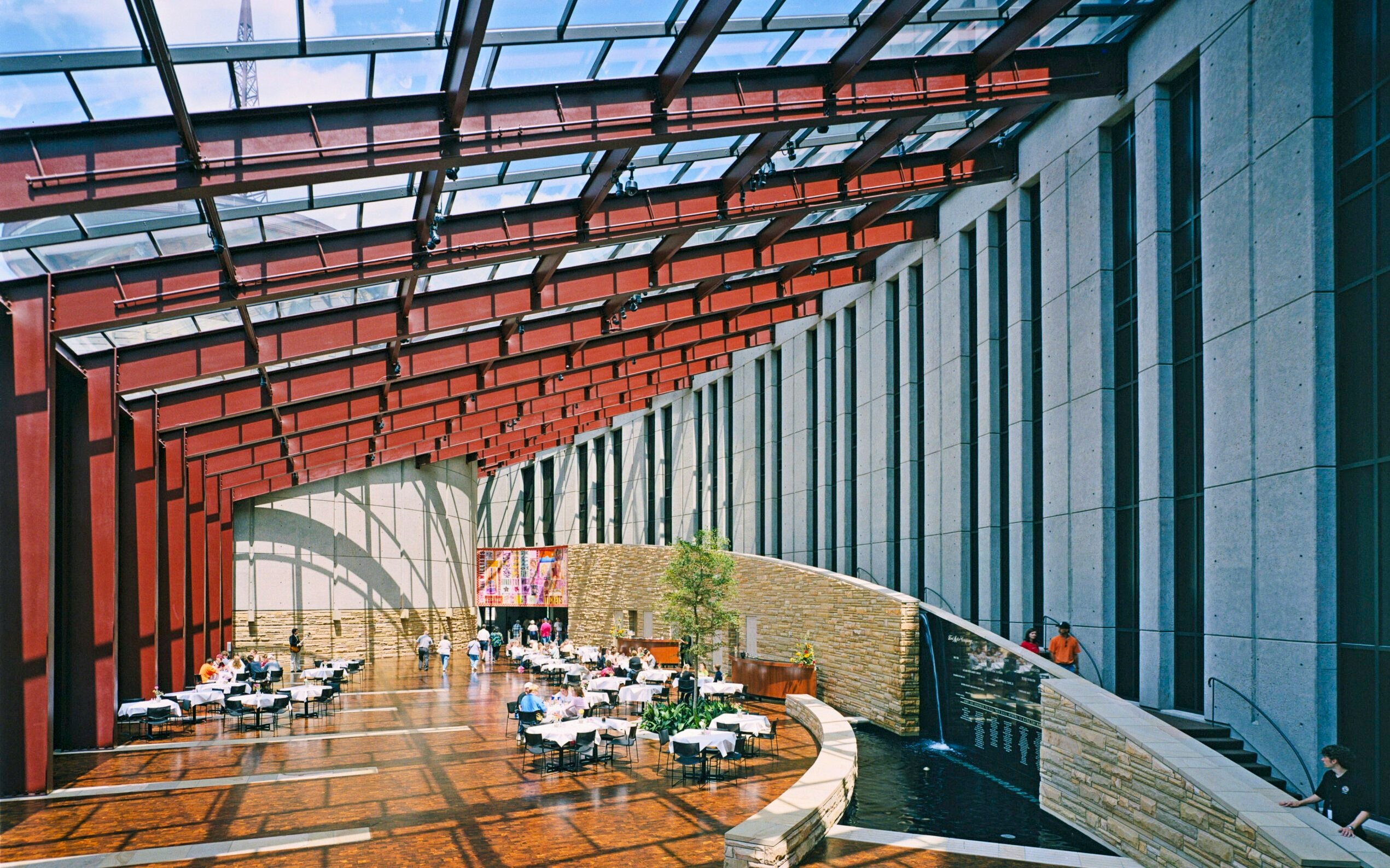 Interior of Country Music Hall of Fame with dining area and modern architecture.