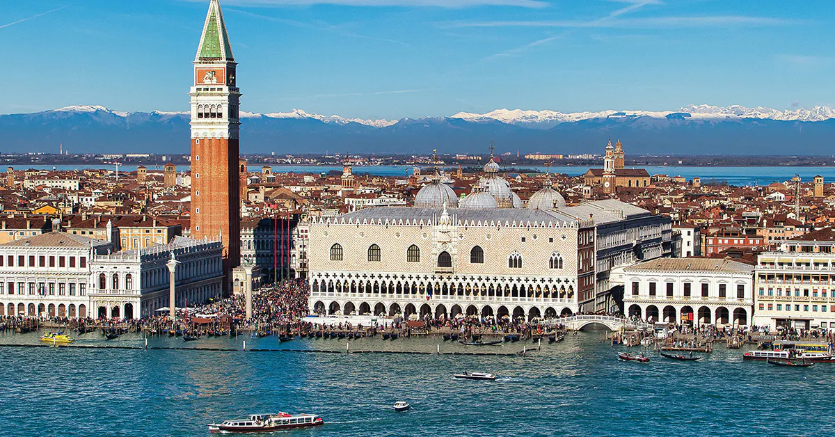 Doge's Palace aerial view with boats on the Grand Canal, Venice, Italy.