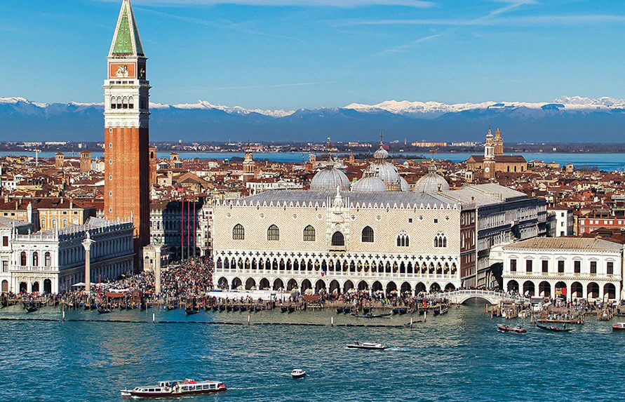 Doge's Palace aerial view with boats on the Grand Canal, Venice, Italy.