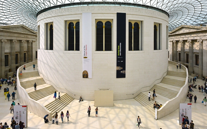 British Museum entrance with visitors, showcasing audio tour and priority access.