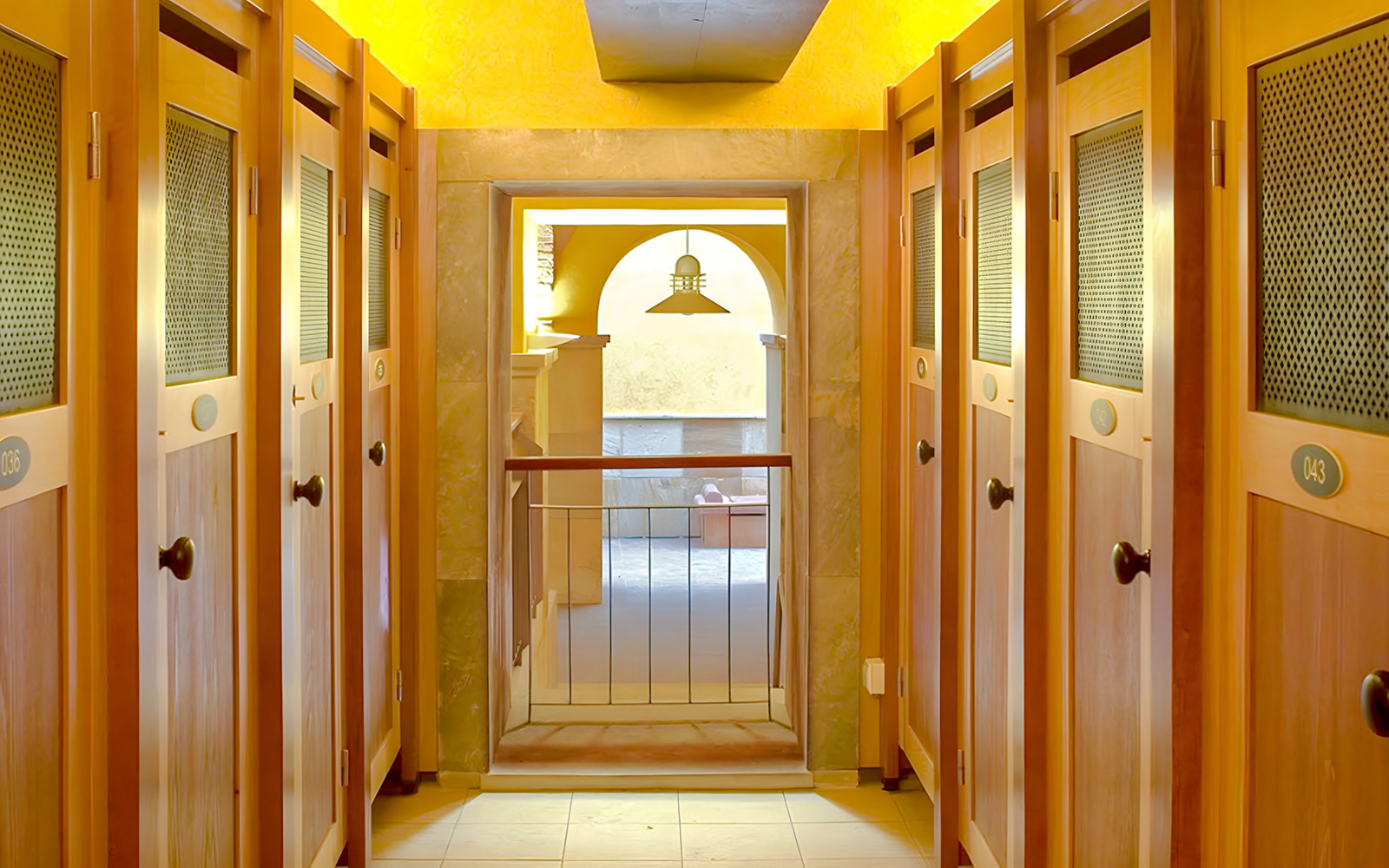 Lockers inside Rudas Thermal Spa with wooden doors and a view of the spa area.