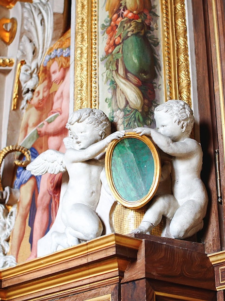 Cherubs and ornate frescoes in Château de Fontainebleau Grand Apartments.