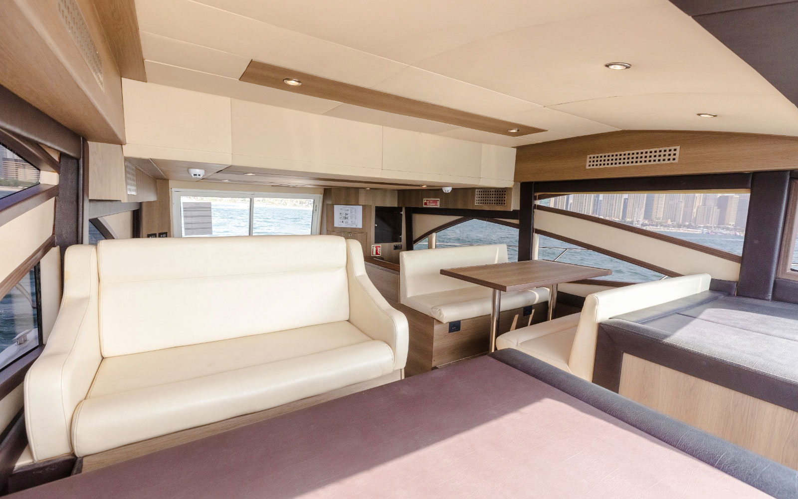 Interior seating area of Viktoriia Luxury Yacht with ocean view.