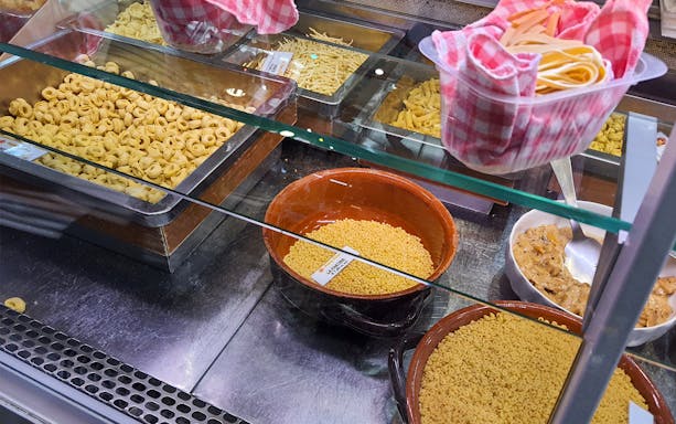 Fresh pasta varieties displayed in a Florence market during a street food tour.