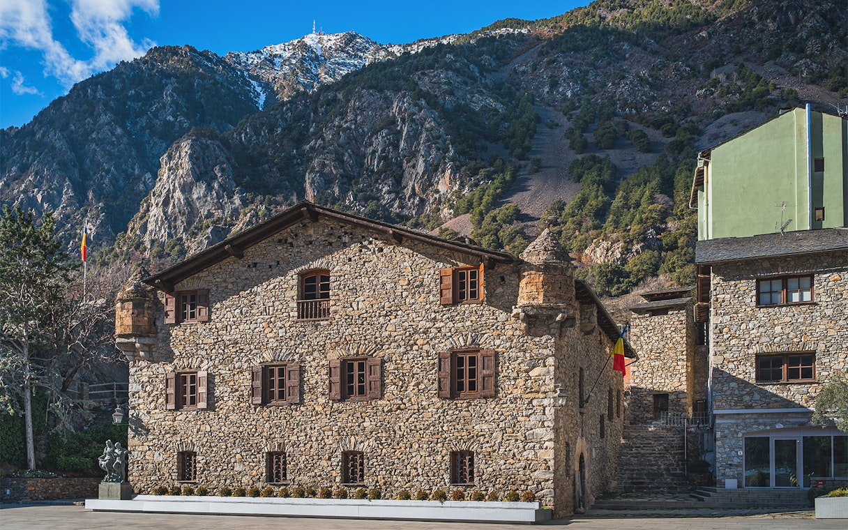 Stone building in Andorra with mountain backdrop on a full-day tour from Barcelona.
