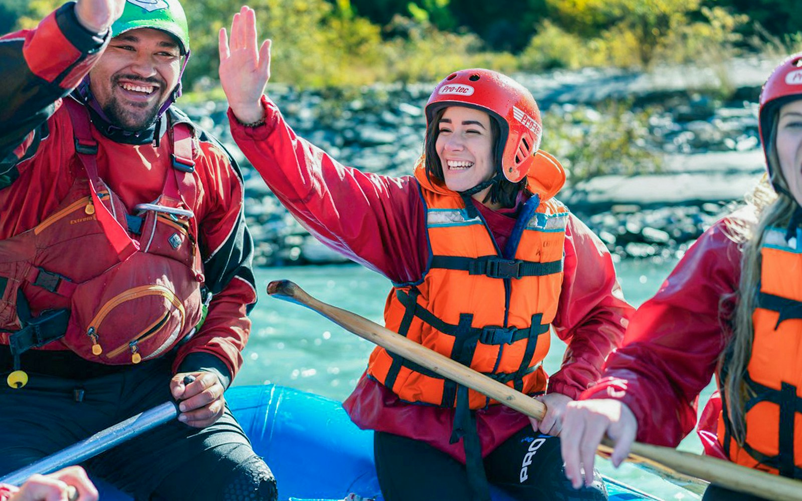 Tourists in life vests rafting on Kawarau River, New Zealand.