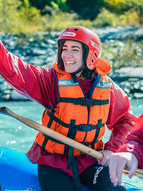 Tourists in life vests rafting on Kawarau River, New Zealand.