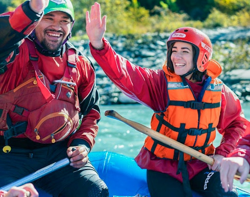 Tourists in life vests rafting on Kawarau River, New Zealand.