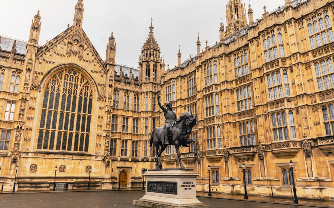 Houses of Parliament facade with Richard the Lionheart statue, London.