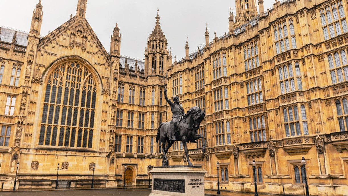 Houses of Parliament facade with Richard the Lionheart statue, London.
