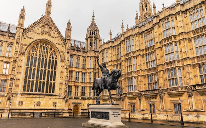Houses of Parliament facade with Richard the Lionheart statue, London.