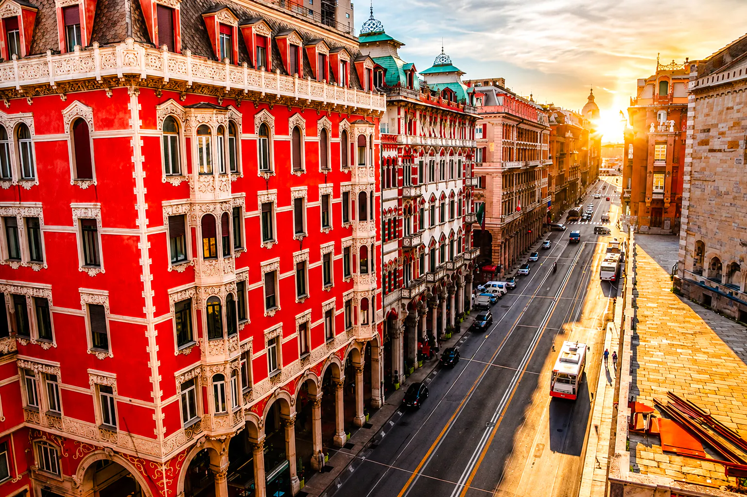 Street view of historic buildings in Genoa during sunset, part of a walking dinner tour.