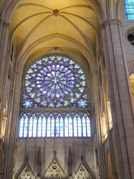 Notre Dame's rose window with intricate stained glass design.