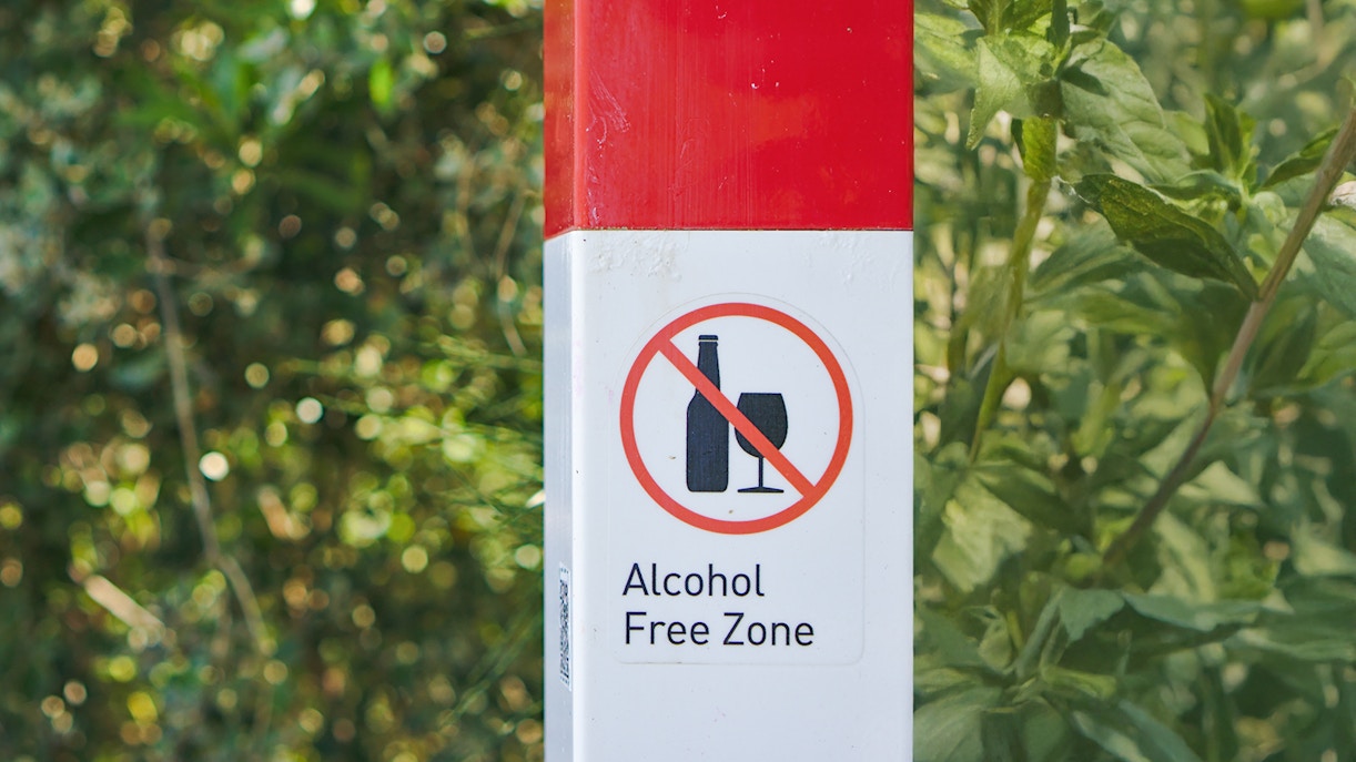 A signboard reading "Alcohol free zone" fixed onto a pole