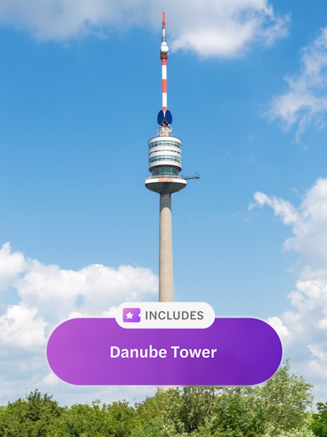 Danube Tower in Vienna against a blue sky.