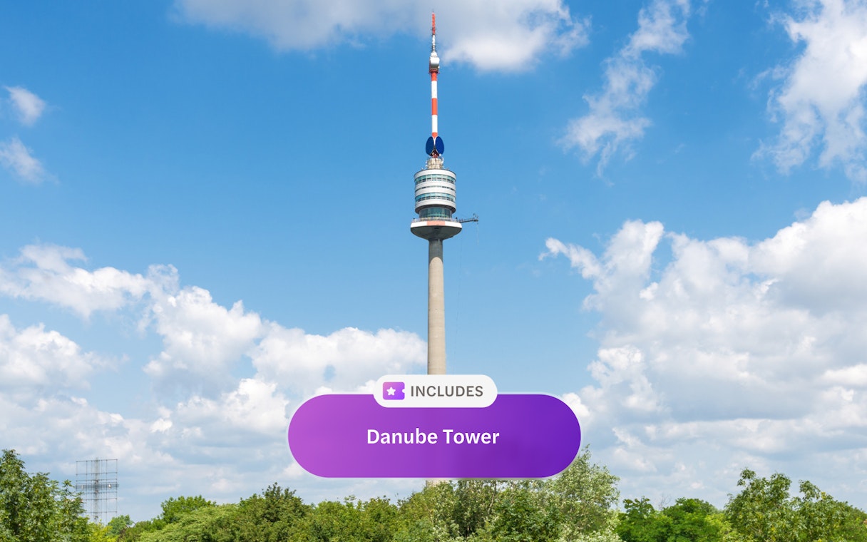 Danube Tower in Vienna against a blue sky.