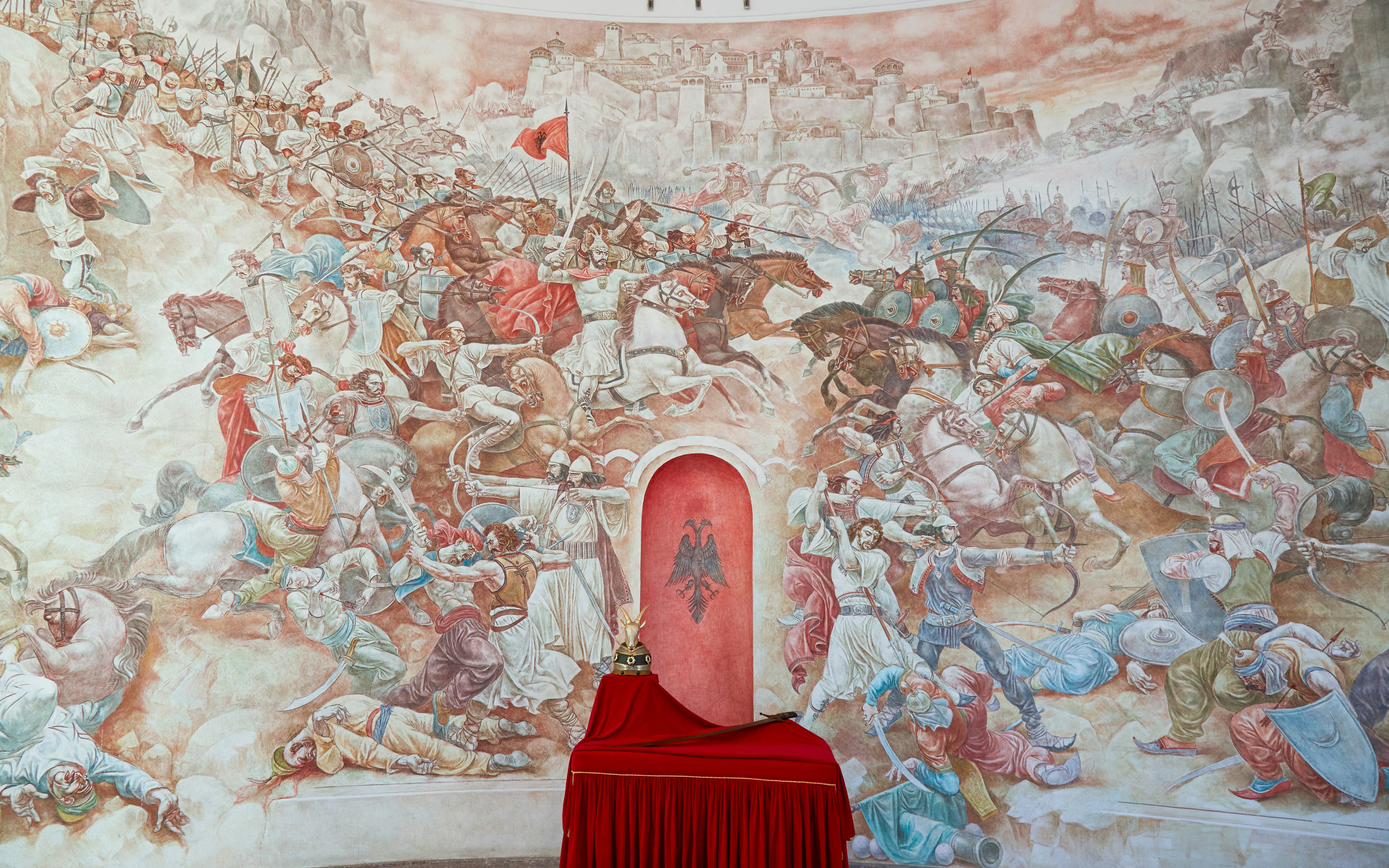 Battle mural at Skanderbeg Museum, Kruje Castle, Albania depicting historical scenes.