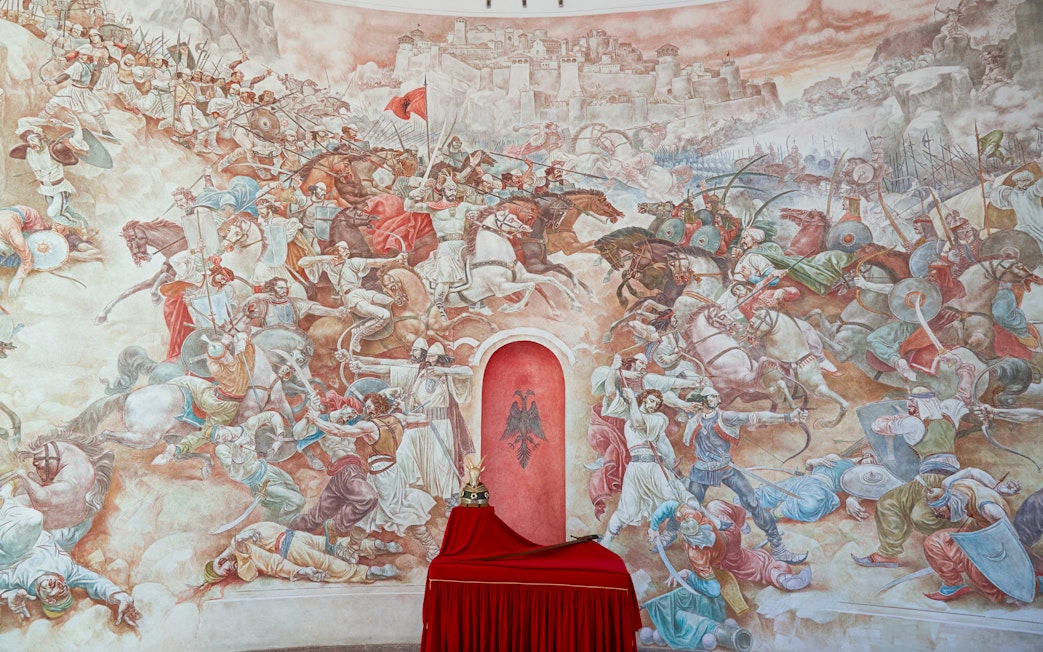 Battle mural at Skanderbeg Museum, Kruje Castle, Albania depicting historical scenes.