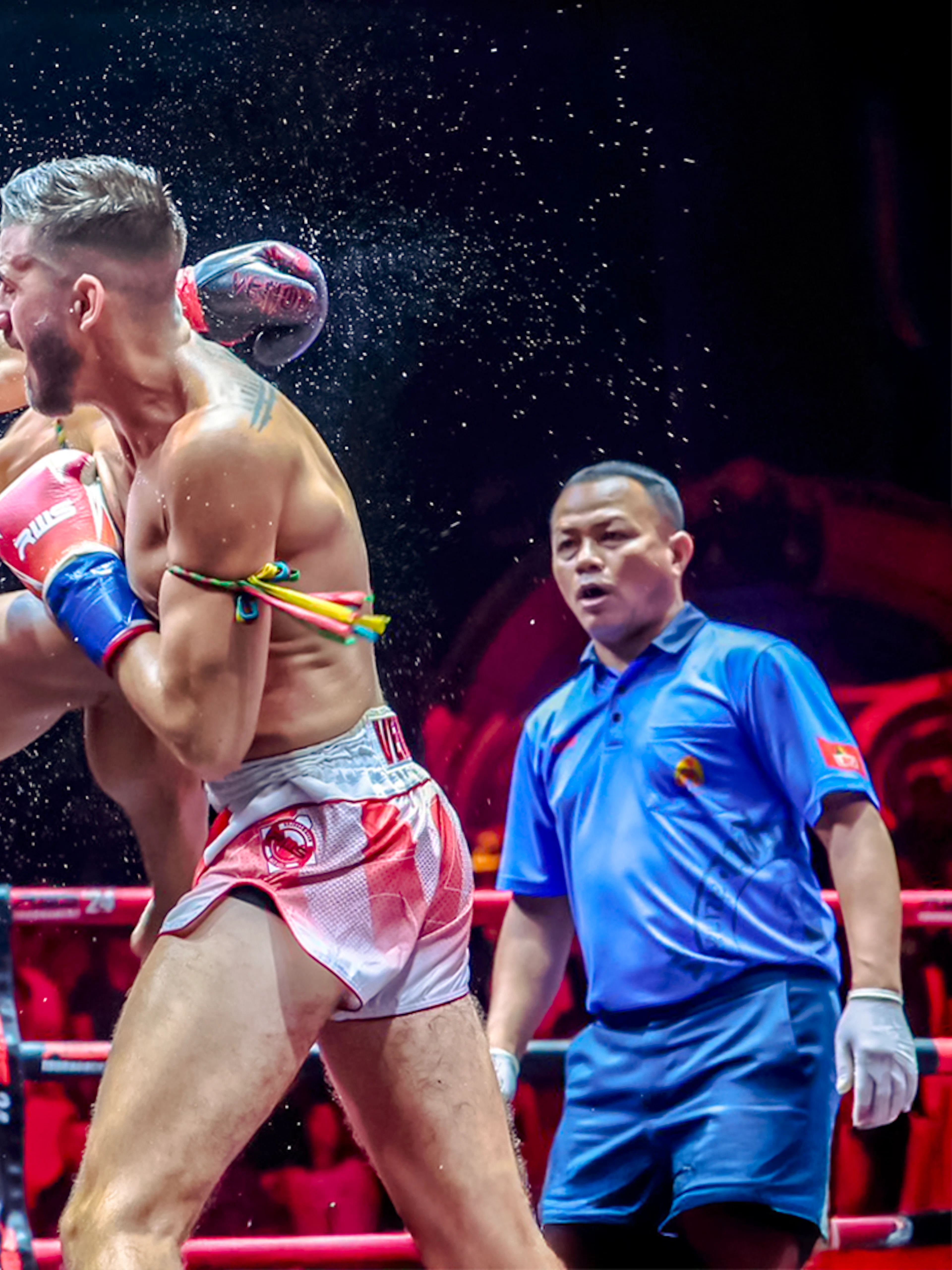 Muay Thai fighters in action at Rajadamnern Boxing Stadium, Bangkok.
