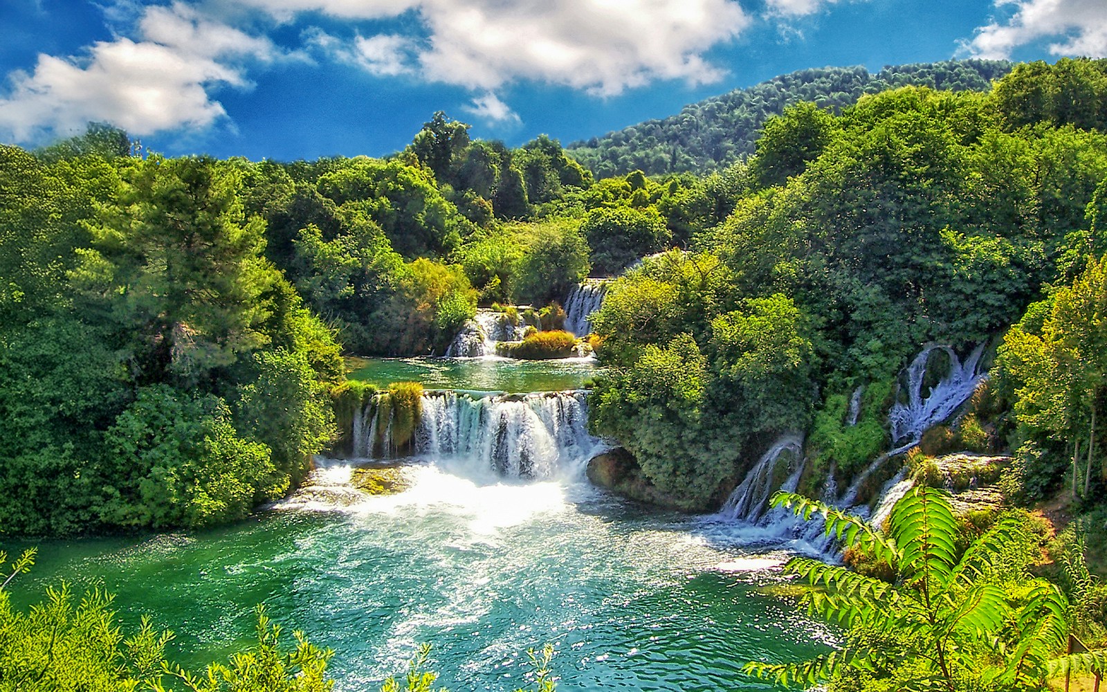 Aerial view of Krka National Park waterfalls and lush greenery, Croatia.