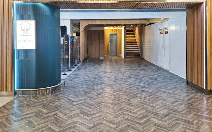 Phoenix Lounge entrance at Dublin Airport Terminal 1 with modern wood design.
