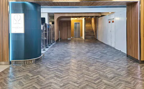 Phoenix Lounge entrance at Dublin Airport Terminal 1 with modern wood design.