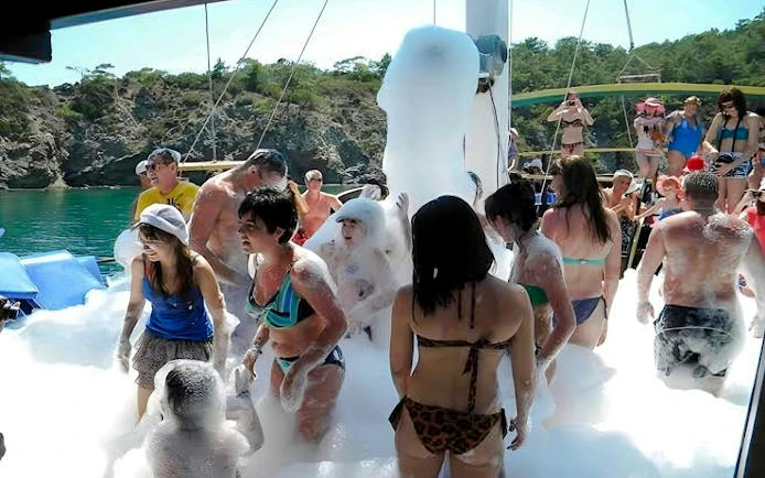Guests enjoying foam party on Manavgat River to Dolphin Island Cruise.