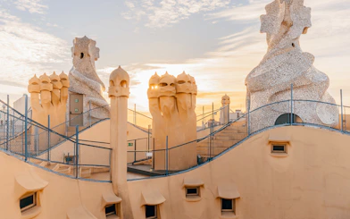 La Pedrera Casa Mila terrace with chimneys at sunrise, Barcelona.