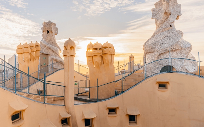 La Pedrera Casa Mila terrace with chimneys at sunrise, Barcelona.
