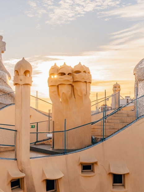 La Pedrera Casa Mila terrace with chimneys at sunrise, Barcelona.