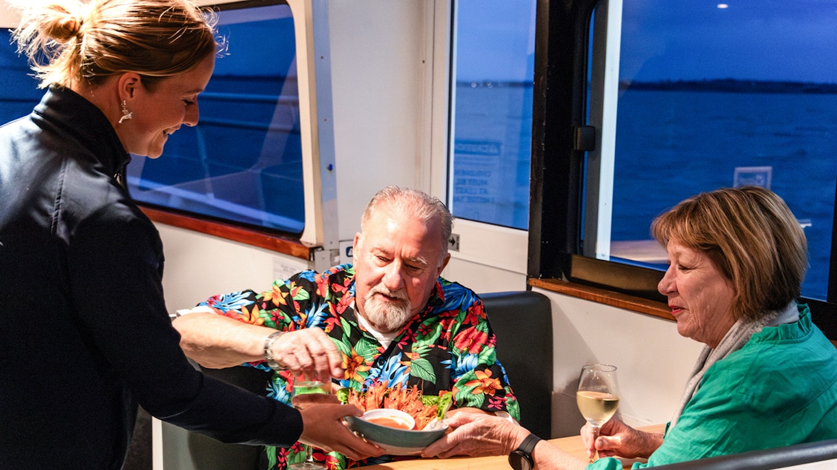 Phillip Island sunset cruise with passengers enjoying views of the coastline.