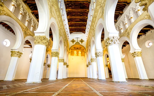 Interior arches and ornate ceiling of Santa Maria La Blanca Church, Toledo.