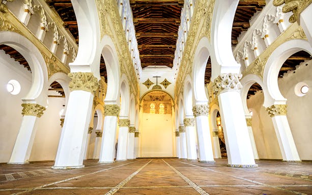 Interior arches and ornate ceiling of Santa Maria La Blanca Church, Toledo.