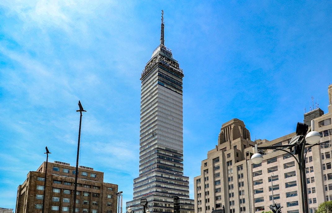 View from Torre Latinoamericana observation deck overlooking Mexico City skyline.