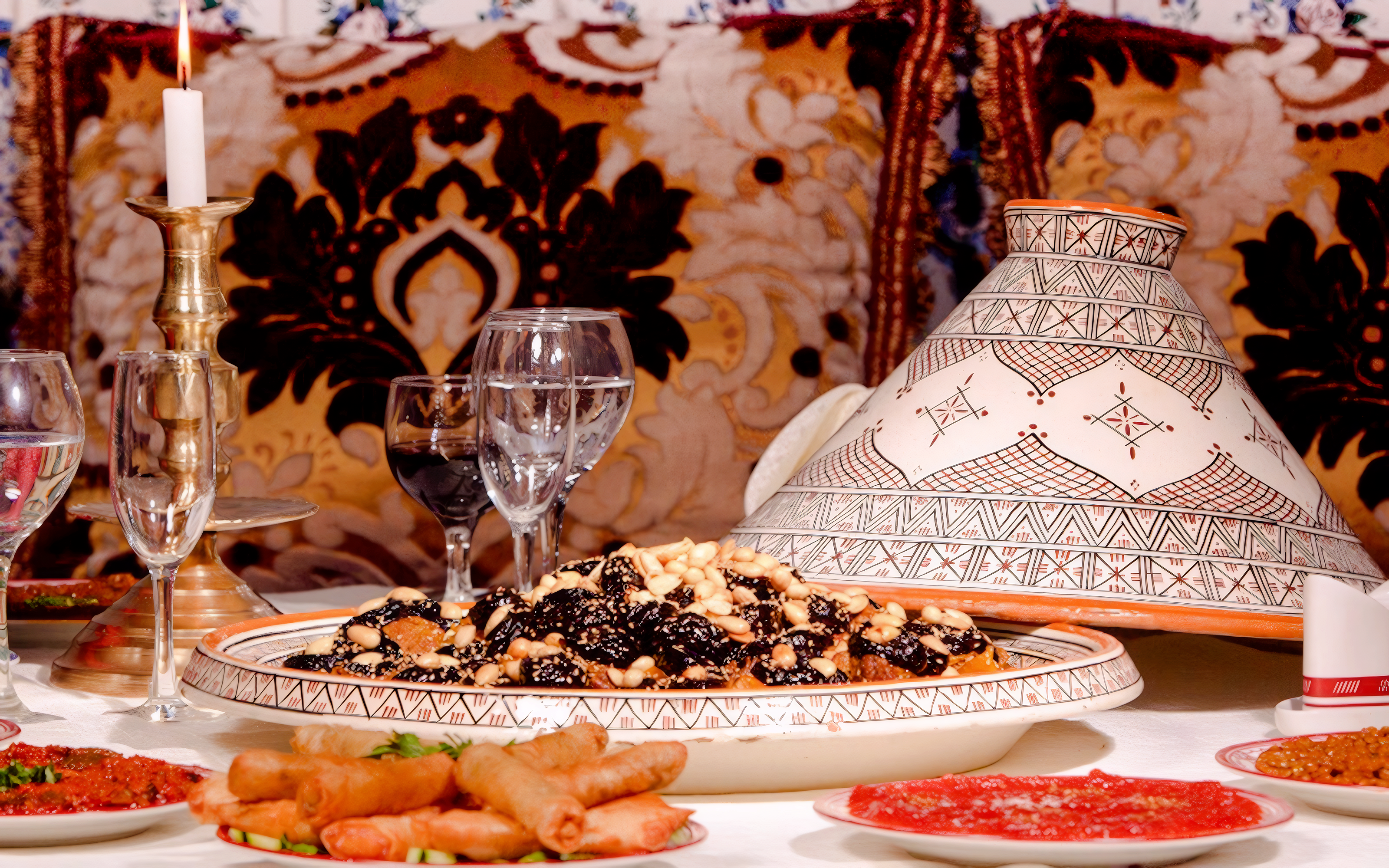 Traditional Moroccan tagine with nuts and dried fruits at Dar Essalam dinner show.