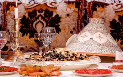 Traditional Moroccan tagine with nuts and dried fruits at Dar Essalam dinner show.