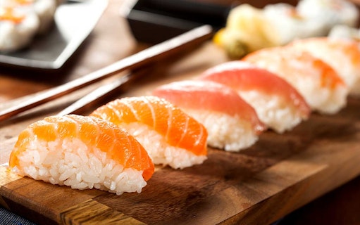 Sushi omakase selection on wooden board at Sushi Kurusu, Tokyo.