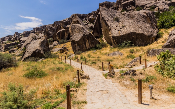 Pathway through rocky terrain in Gobustan petroglyph reserve, Azerbaijan.