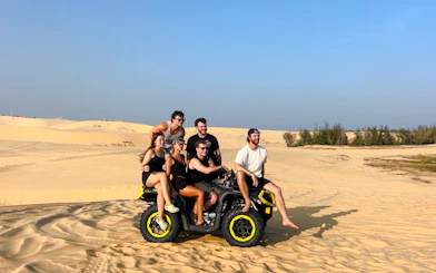 Group on ATV in Mui Ne sand dunes during Jeep tour, Ho Chi Minh City.