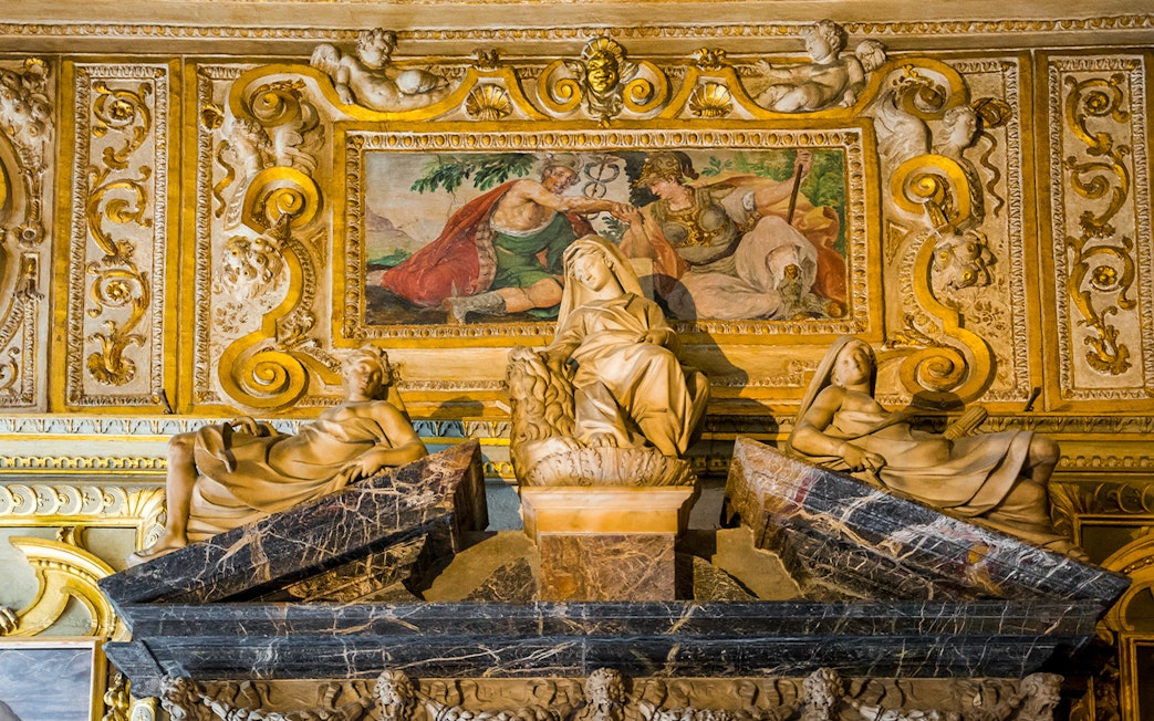 Sculptures and fresco in the Doge's Palace, Venice, depicting classical figures and ornate details.