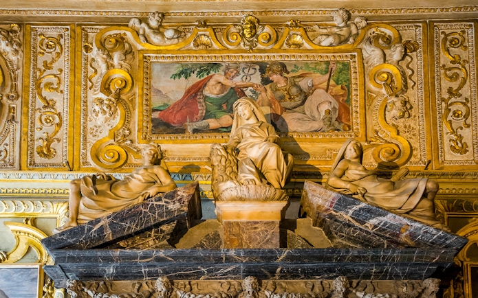 Sculptures and fresco in the Doge's Palace, Venice, depicting classical figures and ornate details.
