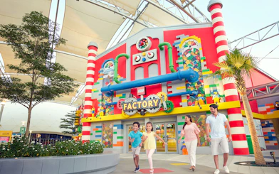 Family walking outside LEGO Factory at LEGOLAND Dubai.